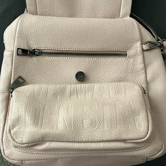 This is a light pink mini back pack that is very spacious and cute. - Picture 1 of 3